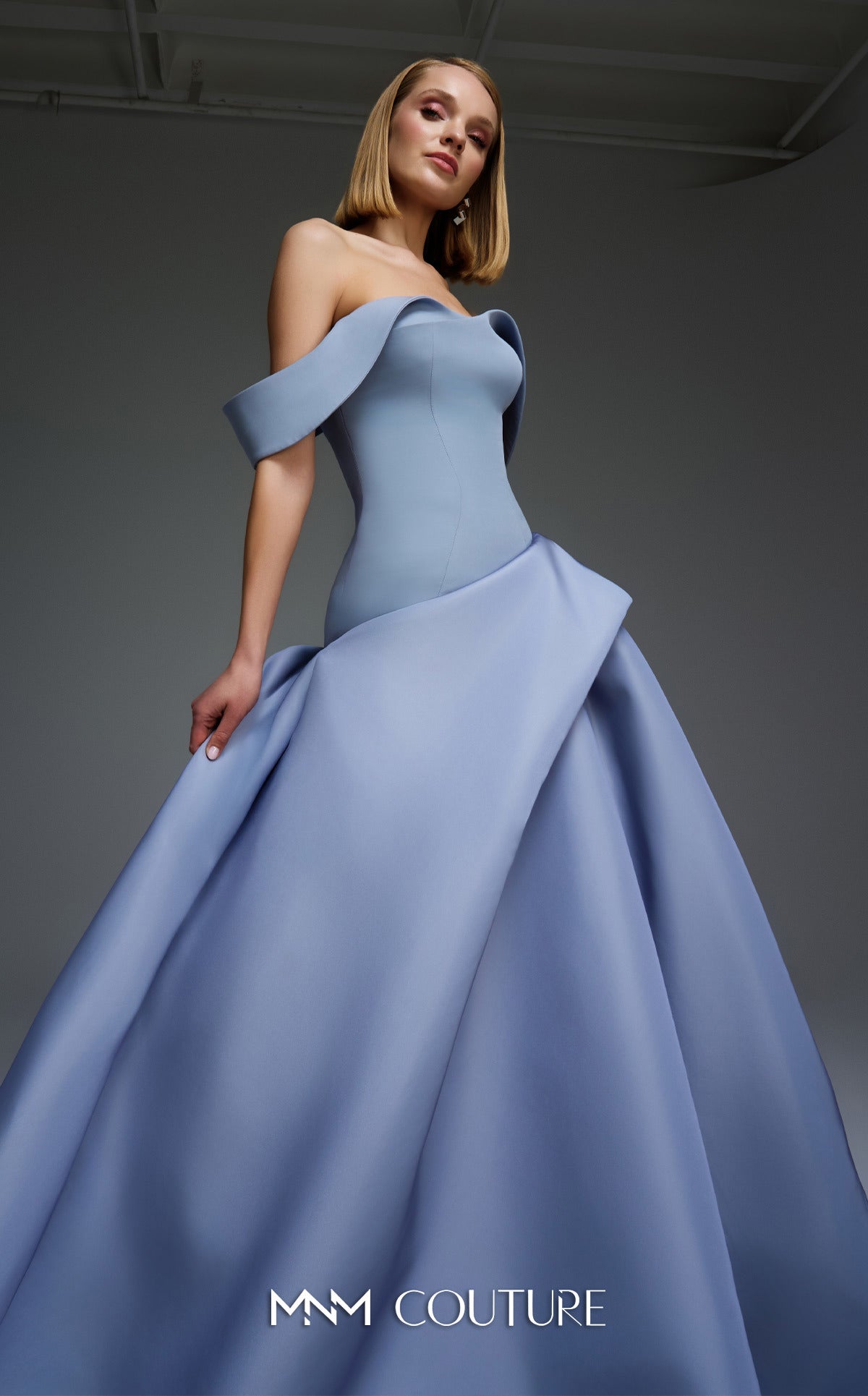 sachin and babi light blue dress Paris Museum to Showcase Azzedine Alaa's Vintage Couture Collection