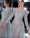 MNM Couture long sleeve beaded gown with overskirt