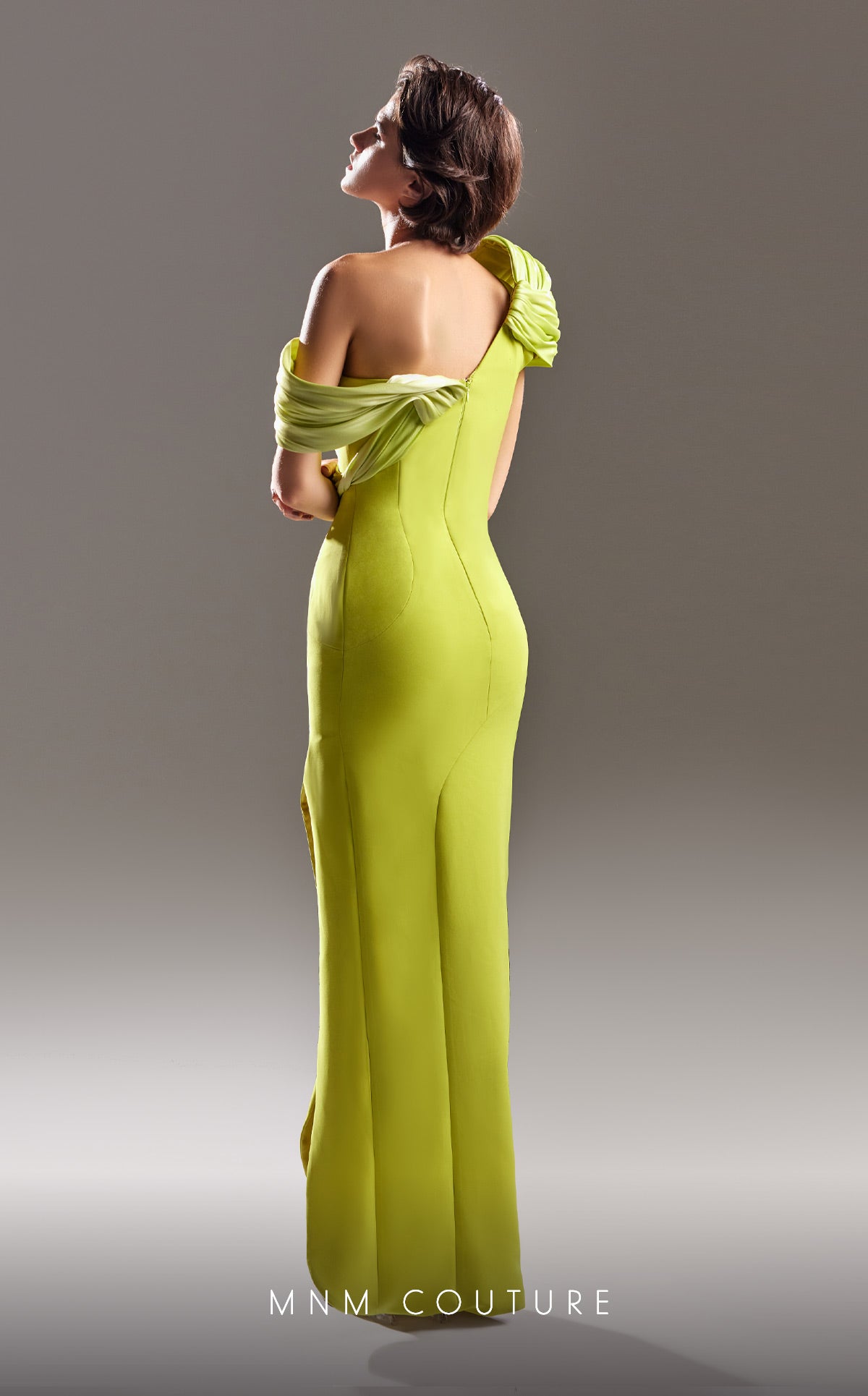MNM Couture G1518 is a classy elegant style with a side slit and beautifully draped shoulder details