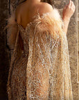 K3945 MNM Couture long sleeve fitted gold sequin dress with feathers and floor length sleeves