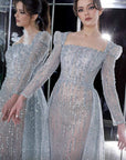 MNM Couture long sleeve beaded gown with overskirt 
